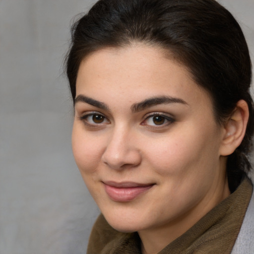 Joyful white young-adult female with medium  brown hair and brown eyes