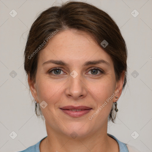 Joyful white adult female with medium  brown hair and grey eyes