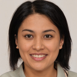 Joyful white young-adult female with medium  brown hair and brown eyes