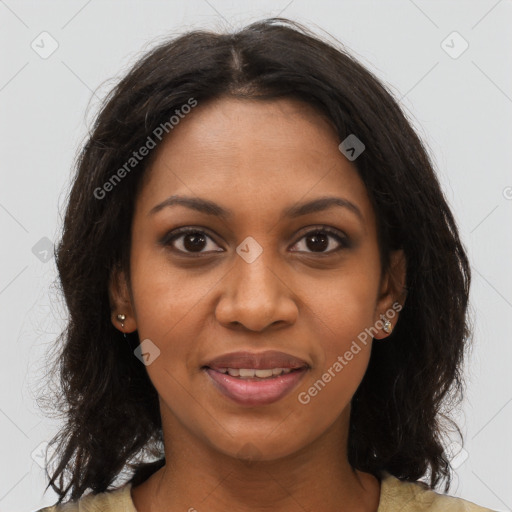 Joyful black young-adult female with long  brown hair and brown eyes