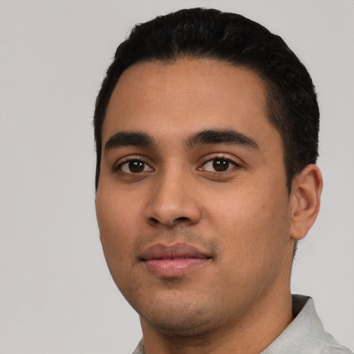 Neutral latino young-adult male with short  black hair and brown eyes
