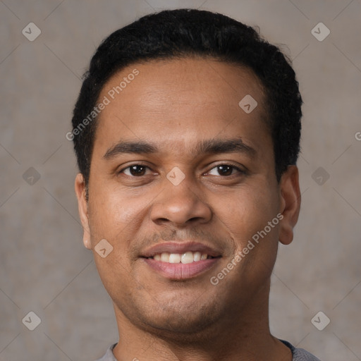 Joyful latino young-adult male with short  black hair and brown eyes