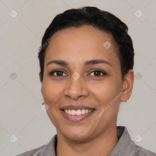 Joyful latino young-adult female with short  black hair and brown eyes