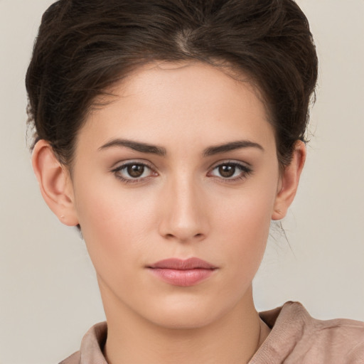 Neutral white young-adult female with short  brown hair and brown eyes