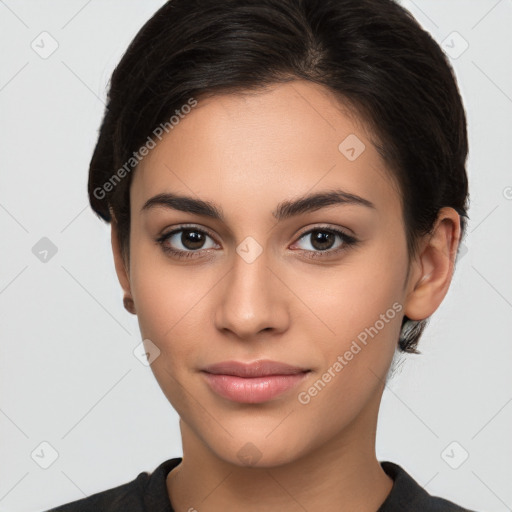 Joyful latino young-adult female with medium  brown hair and brown eyes