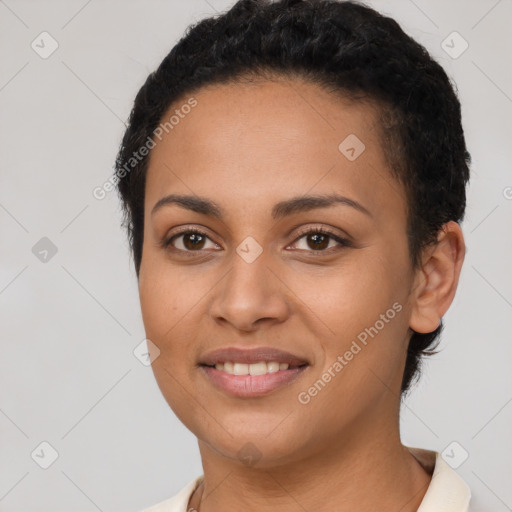 Joyful latino young-adult female with short  black hair and brown eyes