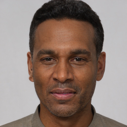 Neutral latino adult male with short  black hair and brown eyes