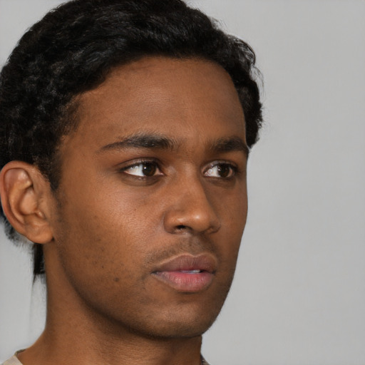 Neutral black young-adult male with short  brown hair and brown eyes