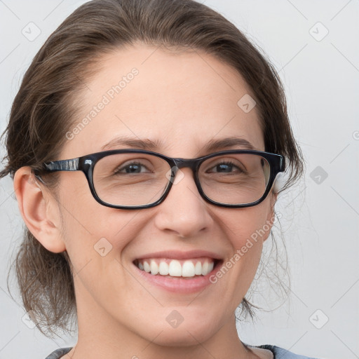 Joyful white young-adult female with medium  brown hair and blue eyes