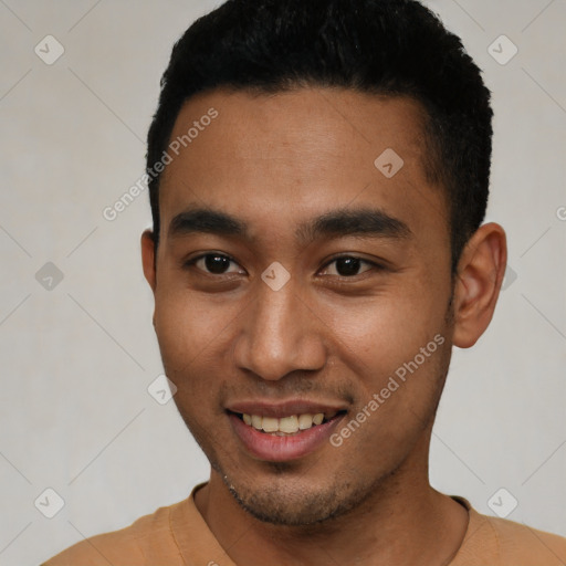 Joyful latino young-adult male with short  black hair and brown eyes