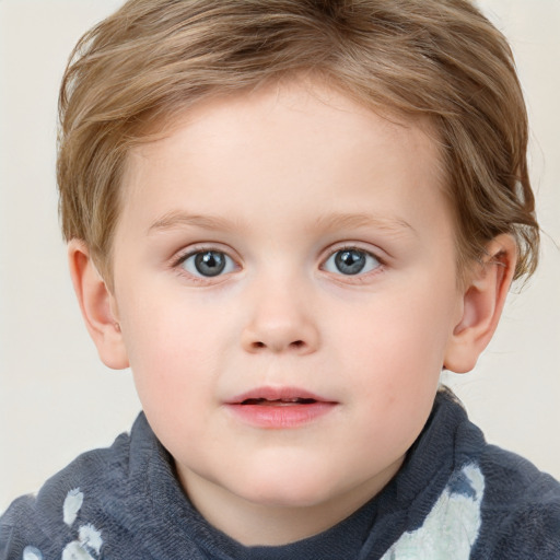 Joyful white child female with short  brown hair and blue eyes