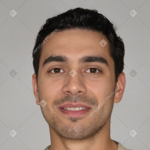 Joyful white young-adult male with short  black hair and brown eyes