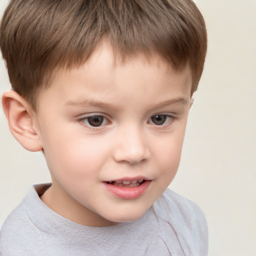 Joyful white child male with short  brown hair and brown eyes