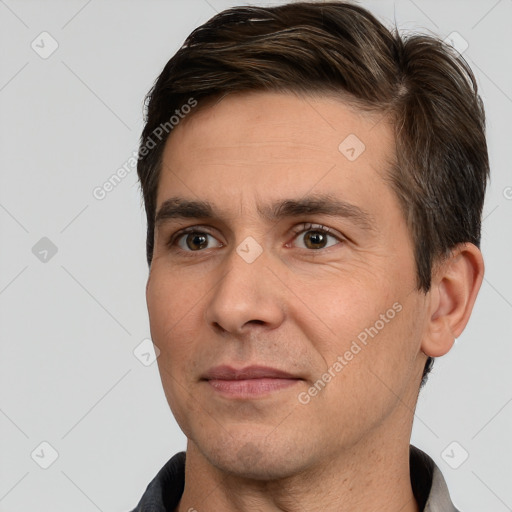 Joyful white adult male with short  brown hair and brown eyes