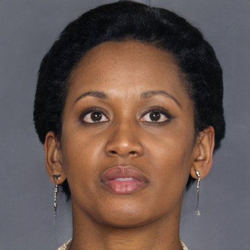 Neutral black young-adult female with medium  brown hair and brown eyes