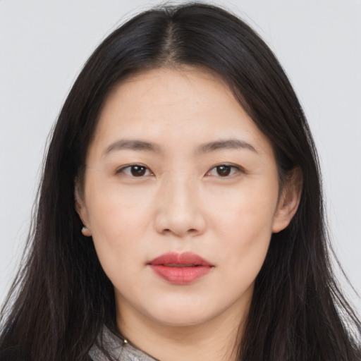Neutral asian young-adult female with long  brown hair and brown eyes