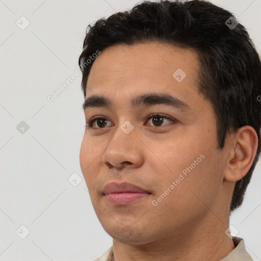 Neutral latino young-adult male with short  black hair and brown eyes