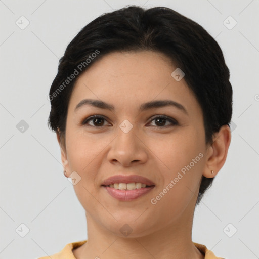 Joyful latino young-adult female with short  brown hair and brown eyes