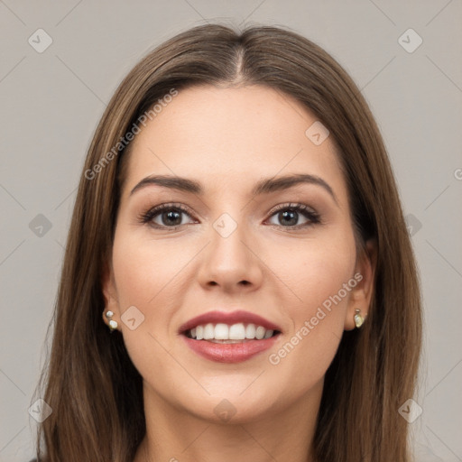 Joyful white young-adult female with long  brown hair and green eyes