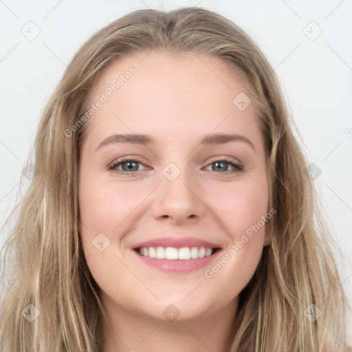 Joyful white young-adult female with long  brown hair and blue eyes