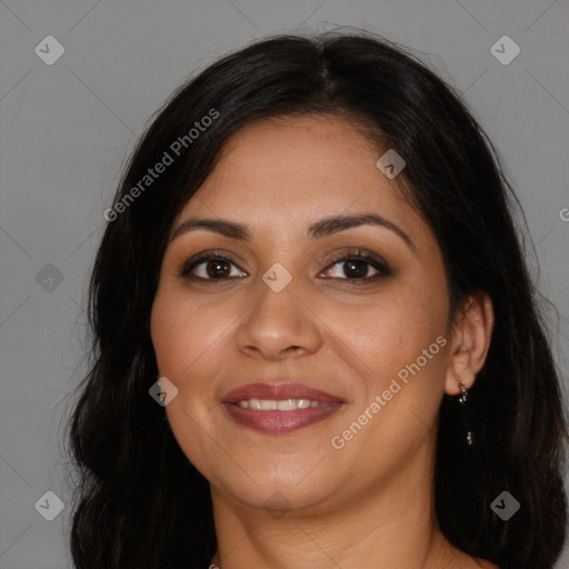 Joyful latino young-adult female with long  brown hair and brown eyes