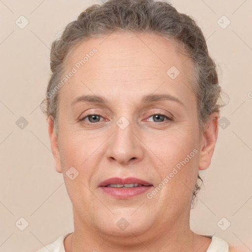 Joyful white adult female with short  brown hair and brown eyes