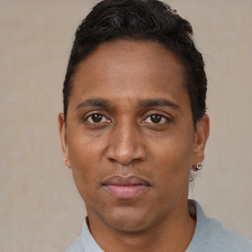 Neutral black adult male with short  black hair and brown eyes