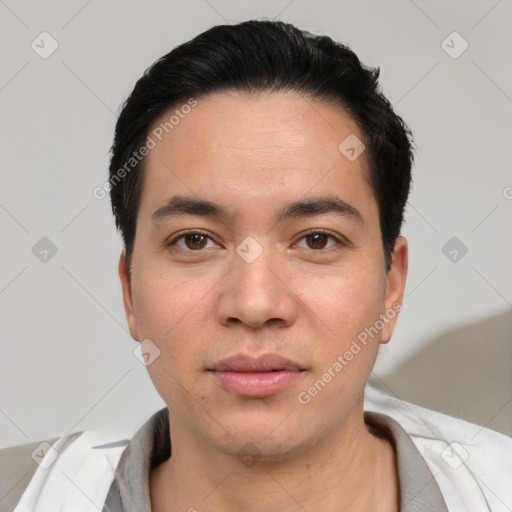 Joyful white young-adult male with short  black hair and brown eyes