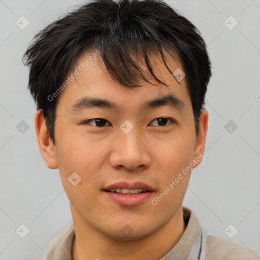 Joyful asian young-adult male with short  brown hair and brown eyes