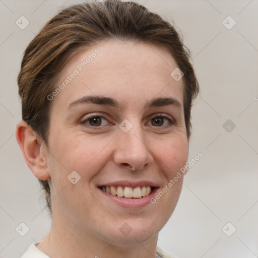 Joyful white young-adult female with short  brown hair and grey eyes