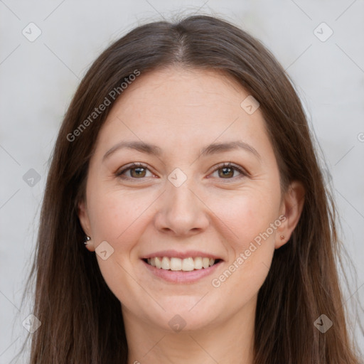 Joyful white young-adult female with long  brown hair and brown eyes