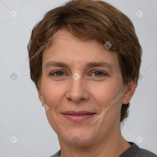 Joyful white adult female with short  brown hair and brown eyes