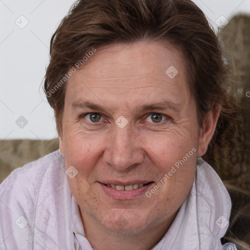 Joyful white adult female with short  brown hair and grey eyes