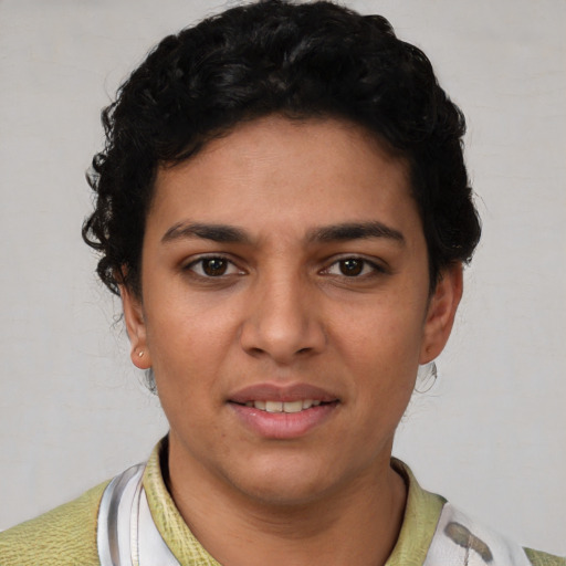 Joyful latino young-adult female with short  brown hair and brown eyes
