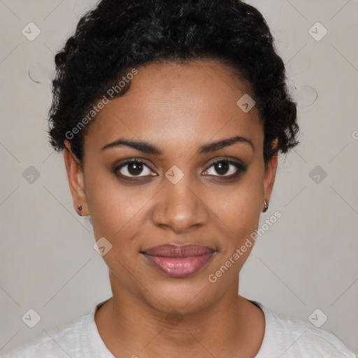 Joyful black young-adult female with short  black hair and brown eyes