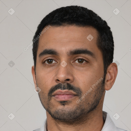 Neutral latino young-adult male with short  black hair and brown eyes