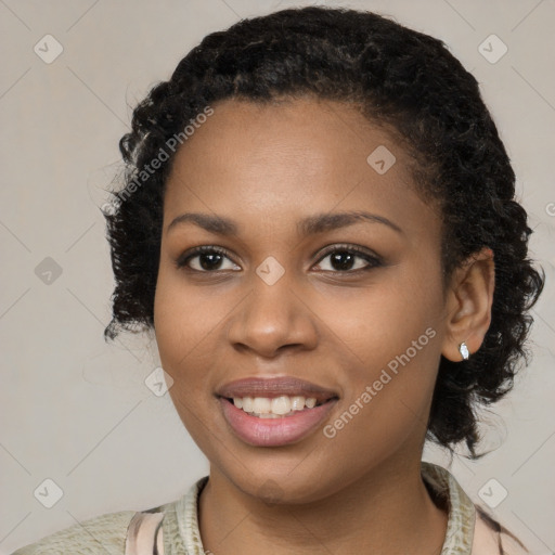 Joyful black young-adult female with medium  black hair and brown eyes