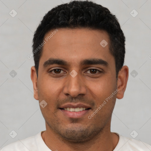 Joyful latino young-adult male with short  black hair and brown eyes