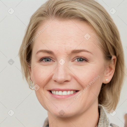 Joyful white young-adult female with medium  brown hair and blue eyes