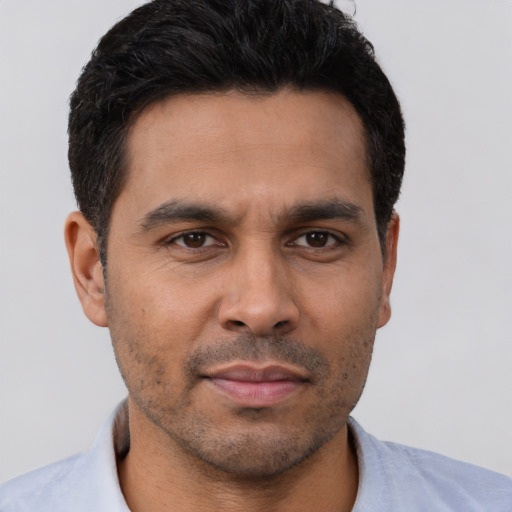 Neutral latino young-adult male with short  brown hair and brown eyes