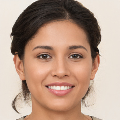 Joyful white young-adult female with medium  brown hair and brown eyes