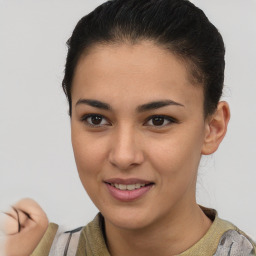 Joyful latino young-adult female with short  brown hair and brown eyes