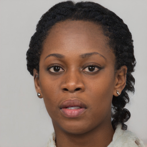 Neutral black young-adult female with short  black hair and brown eyes