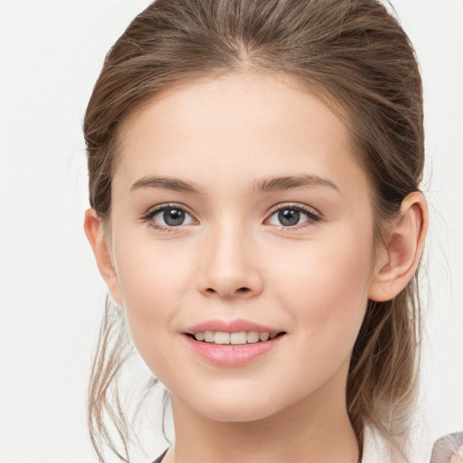 Joyful white child female with medium  brown hair and brown eyes