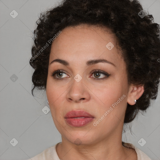 Joyful black young-adult female with medium  brown hair and brown eyes