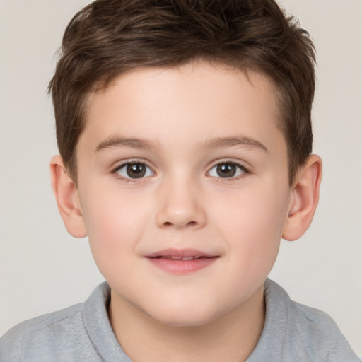 Joyful white child male with short  brown hair and brown eyes