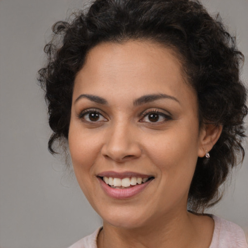 Joyful white young-adult female with medium  brown hair and brown eyes