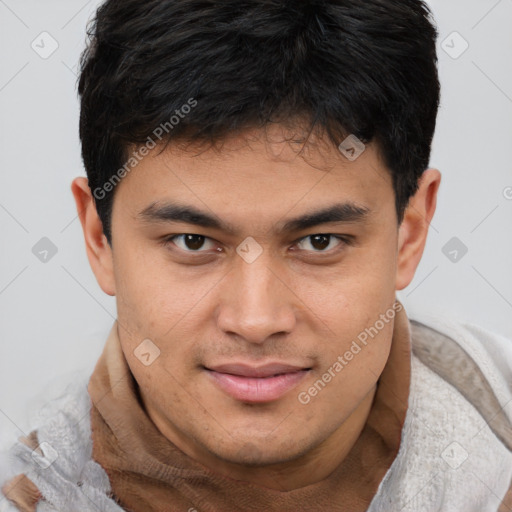 Joyful asian young-adult male with short  brown hair and brown eyes