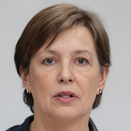 Joyful white adult female with short  brown hair and brown eyes