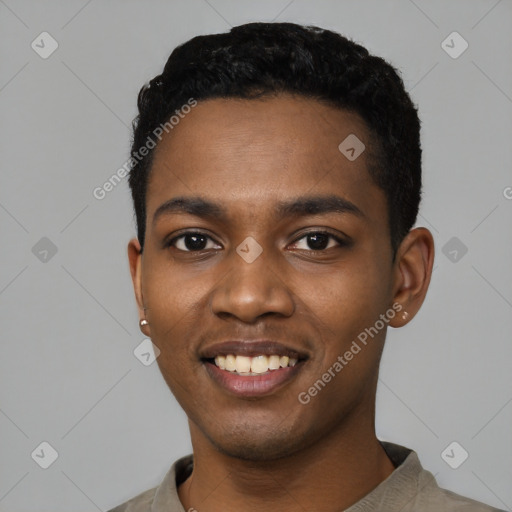 Joyful black young-adult male with short  black hair and brown eyes